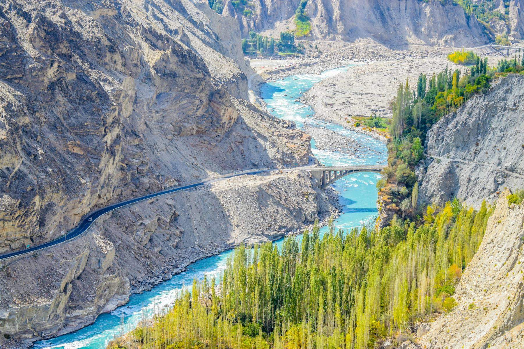 Mountain road along a river in Hunza valley, Pakistan